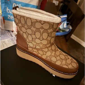 Coach boots size 9. Never worn